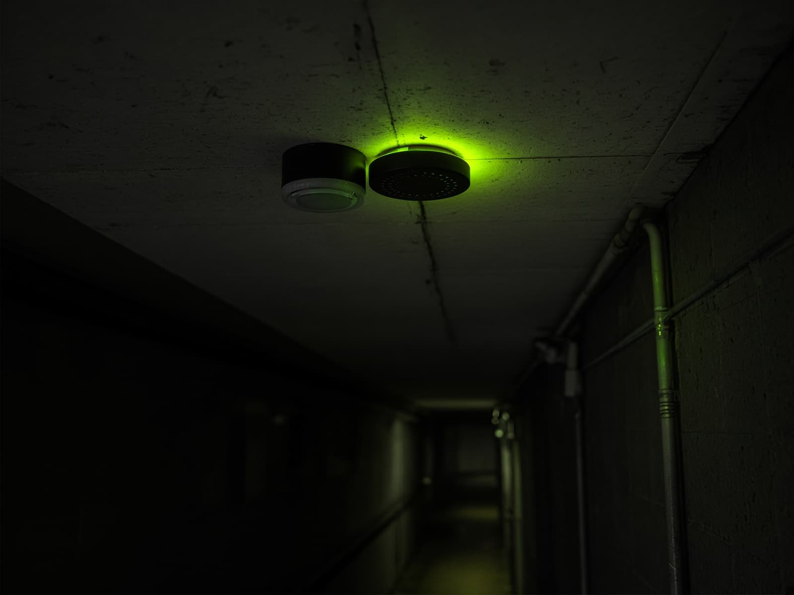 Illustration of a sensor on a corridor ceiling